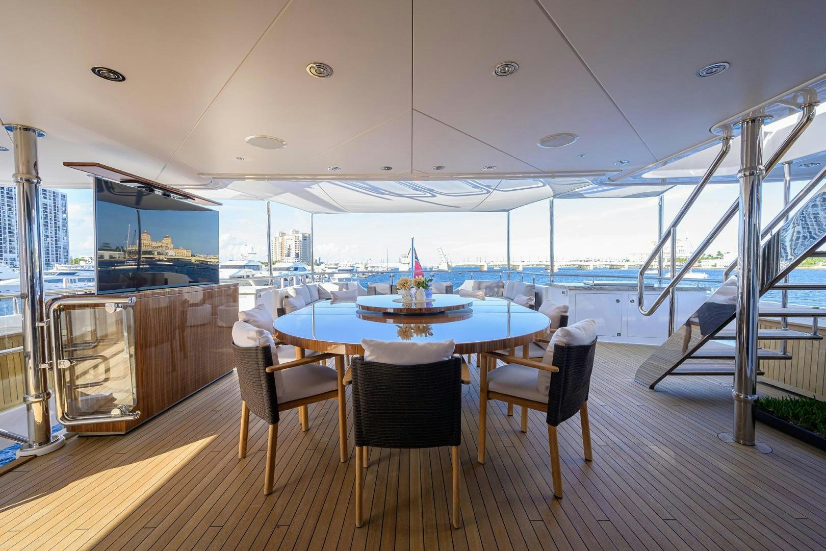 a room with a table and chairs aboard SEANASH Yacht for Sale