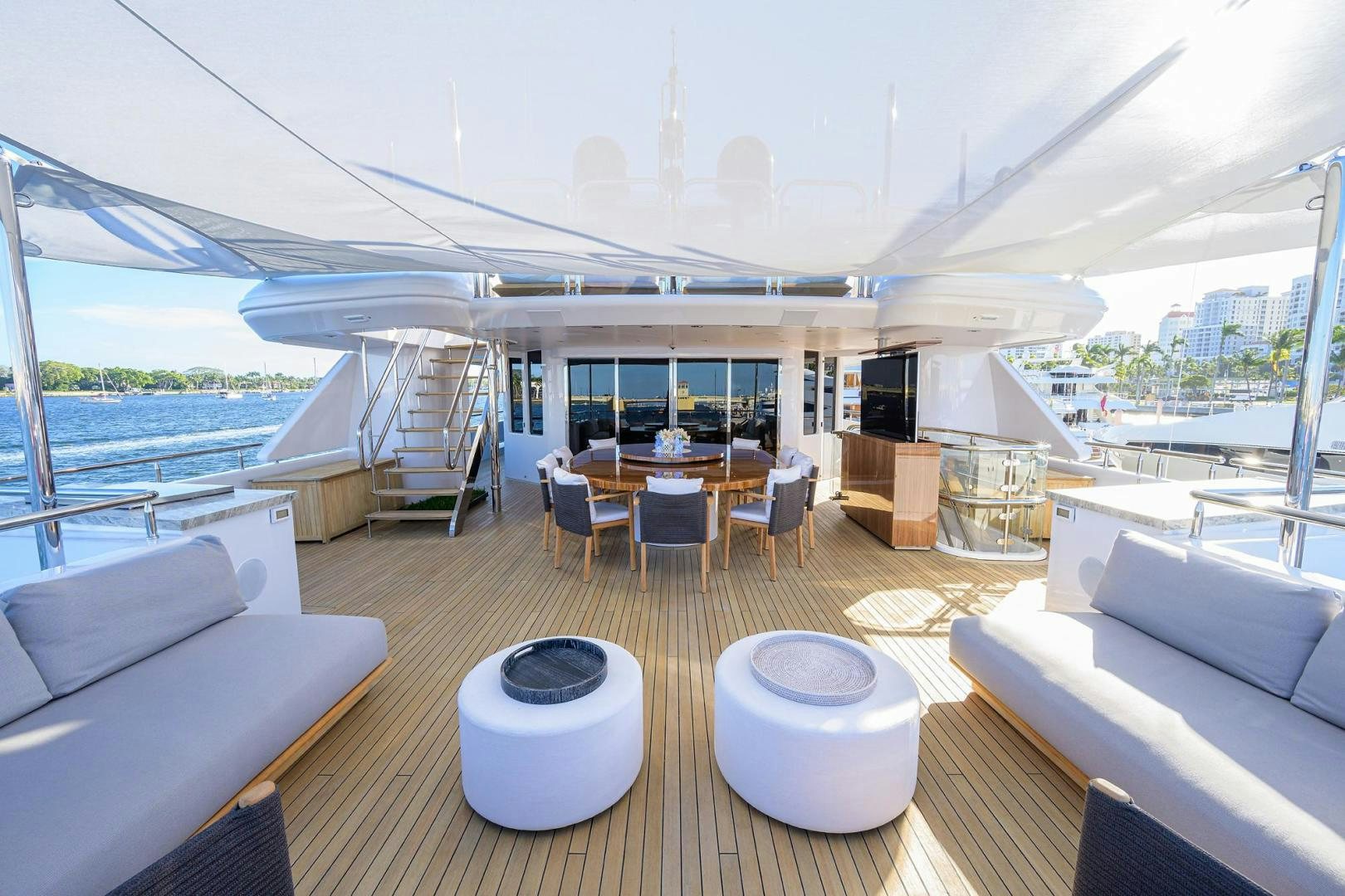 a room with a table chairs and a large window aboard SEANASH Yacht for Sale