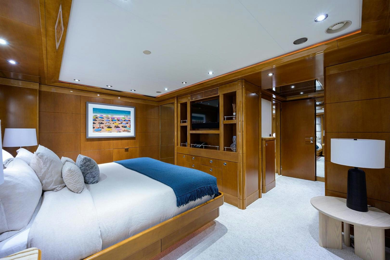 a bedroom with a bed and a desk aboard SEANASH Yacht for Sale