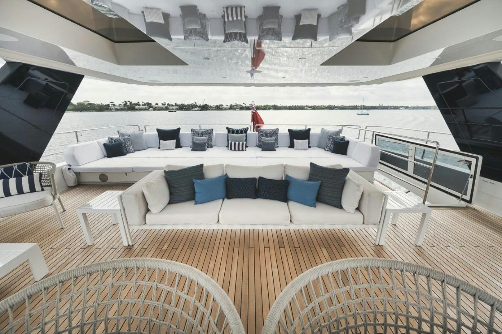 a large lounge area with chairs and a large white lounge chair aboard SANDY II Yacht for Sale