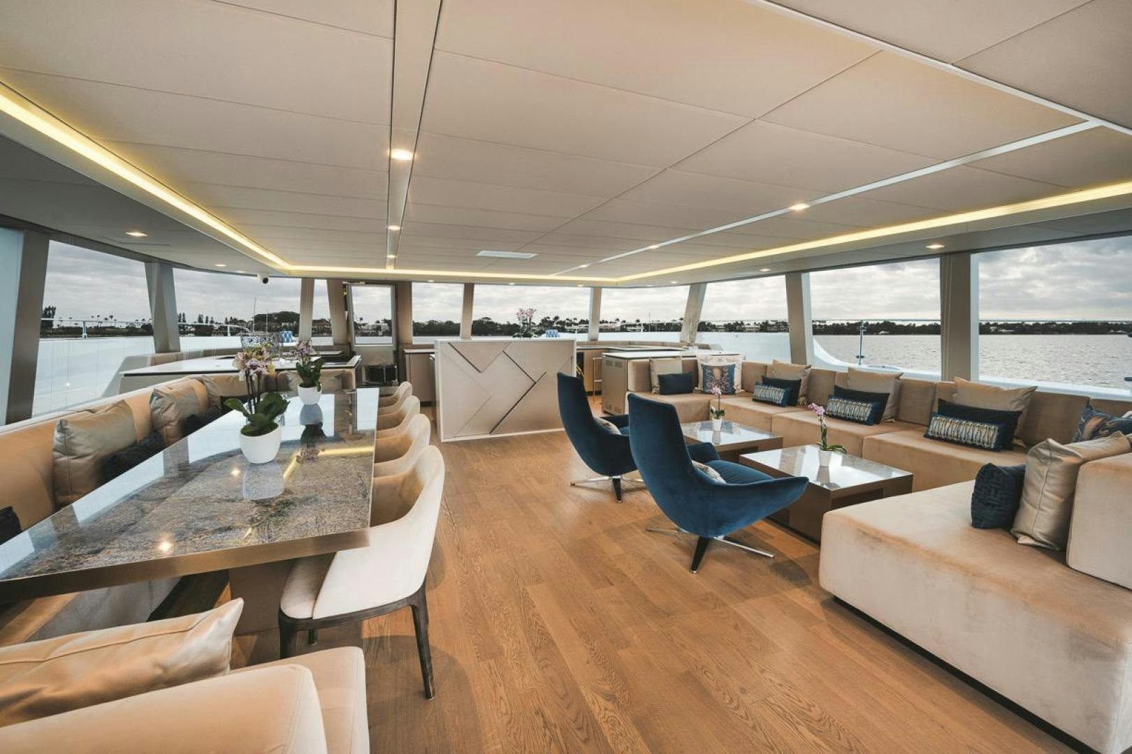 a living room with a large window aboard SANDY II Yacht for Sale