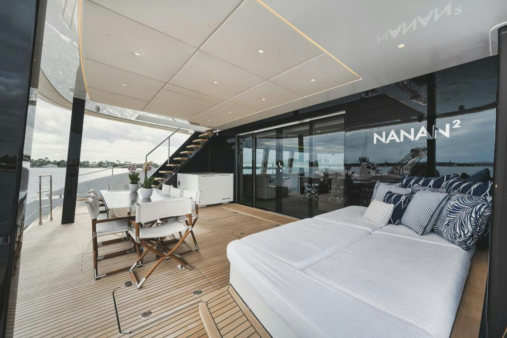 a room with a bed and a table and chairs aboard SANDY II Yacht for Sale