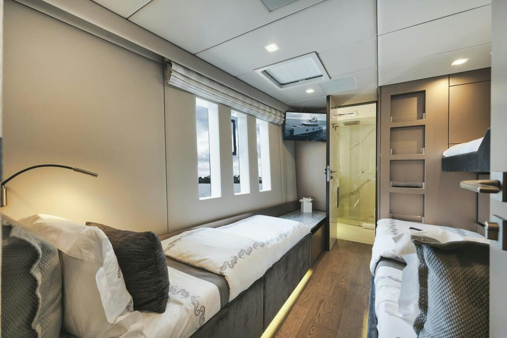 a room with two beds aboard SANDY II Yacht for Sale