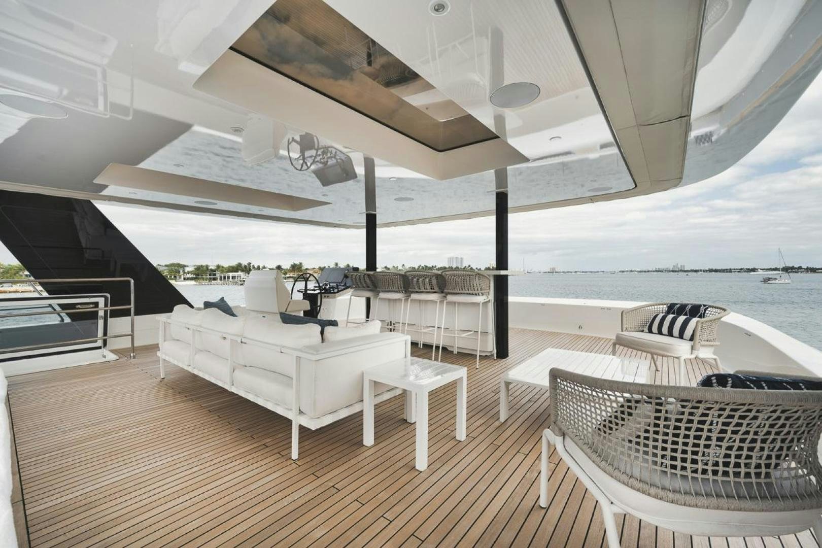 a room with a couch and a table and chairs aboard SANDY II Yacht for Sale