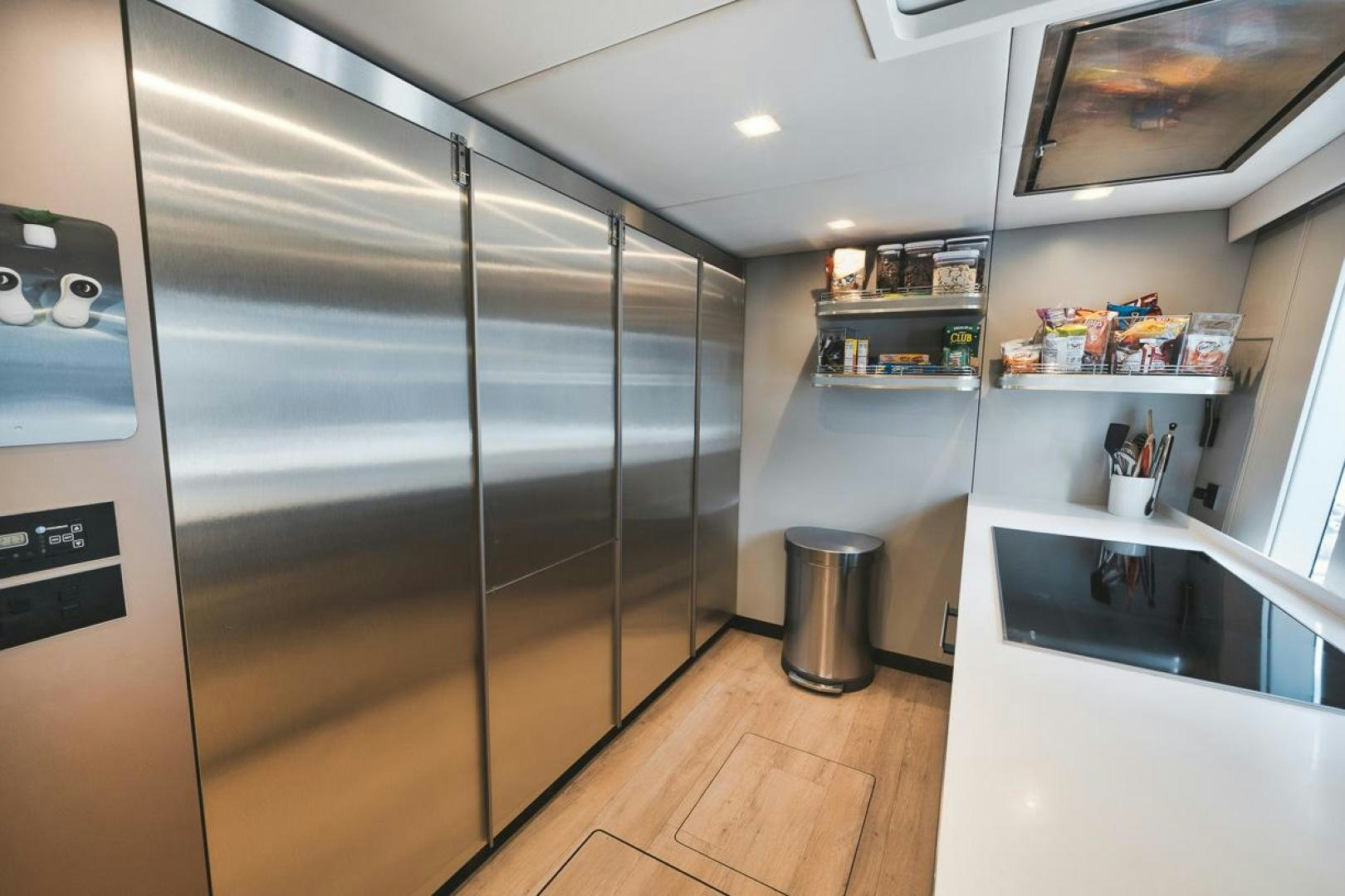 a large kitchen with stainless steel appliances aboard SANDY II Yacht for Sale