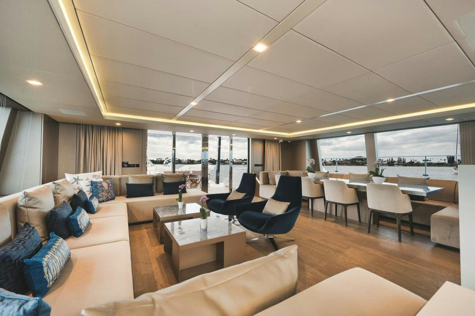 a living room with a large window aboard SANDY II Yacht for Sale