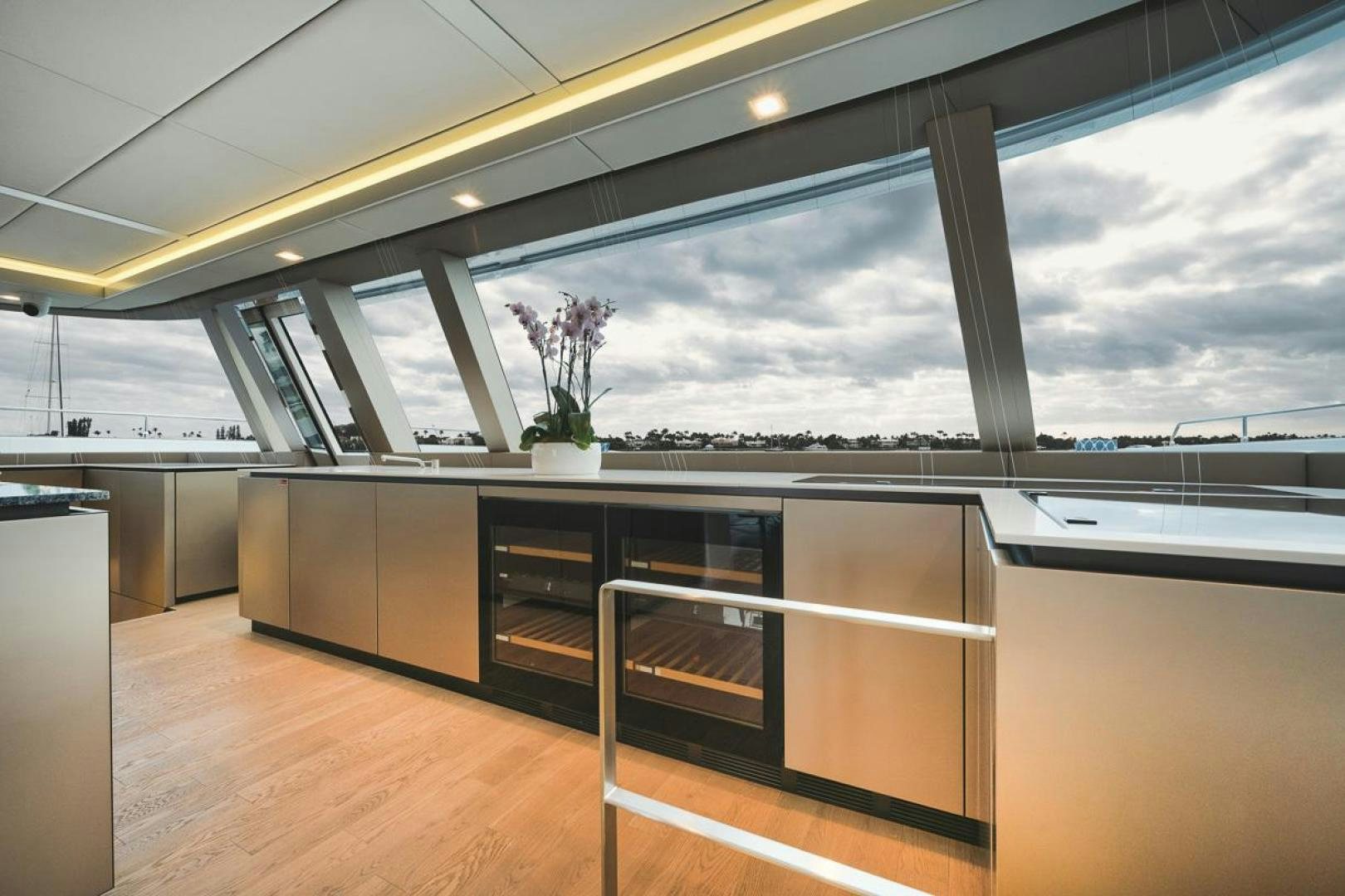 a large modern building with glass walls aboard SANDY II Yacht for Sale