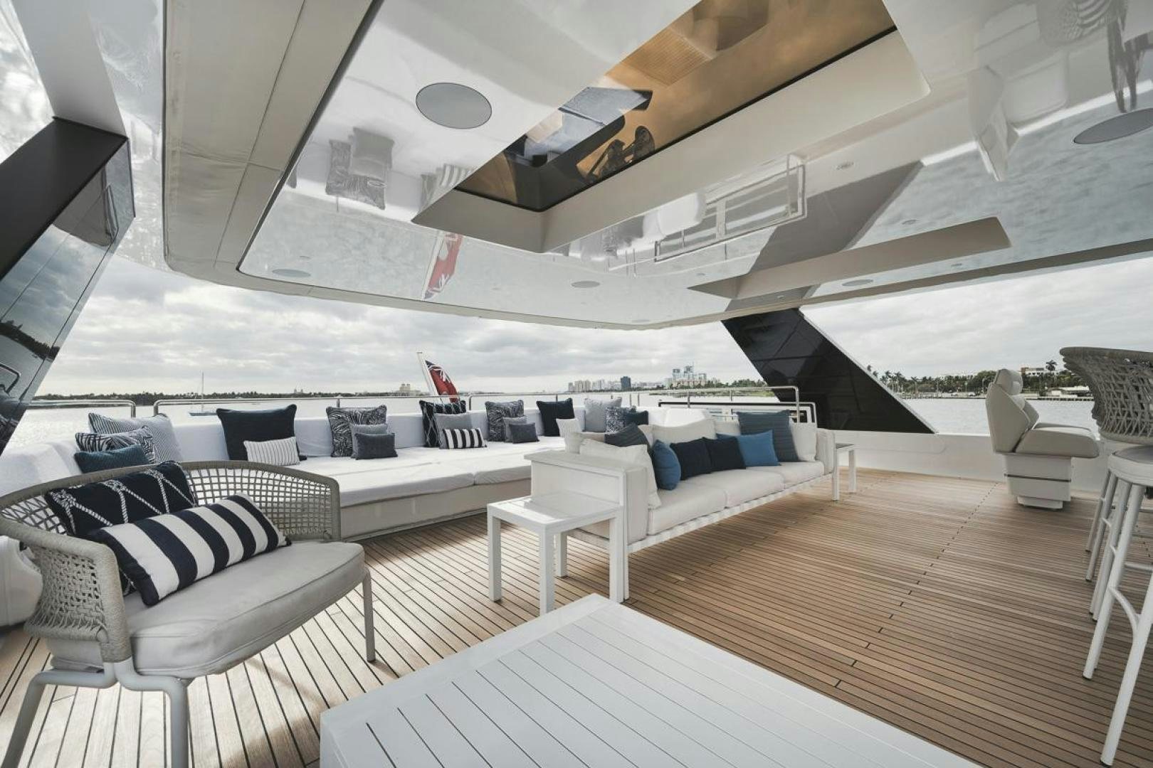 a room with a couch and a table and chairs aboard SANDY II Yacht for Sale