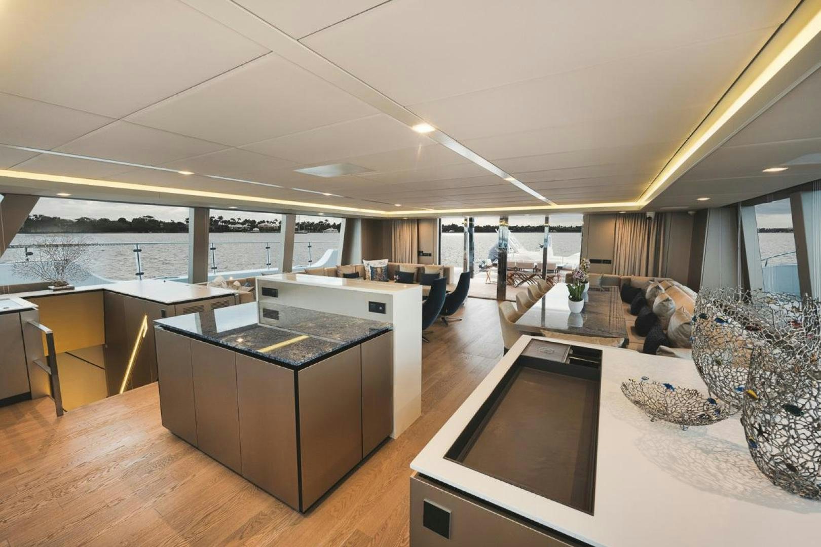 a large modern looking room with a large open floor plan aboard SANDY II Yacht for Sale