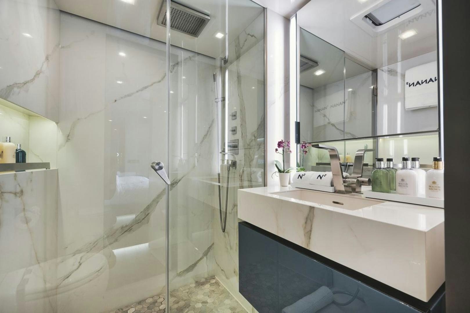 a bathroom with a large shower aboard SANDY II Yacht for Sale