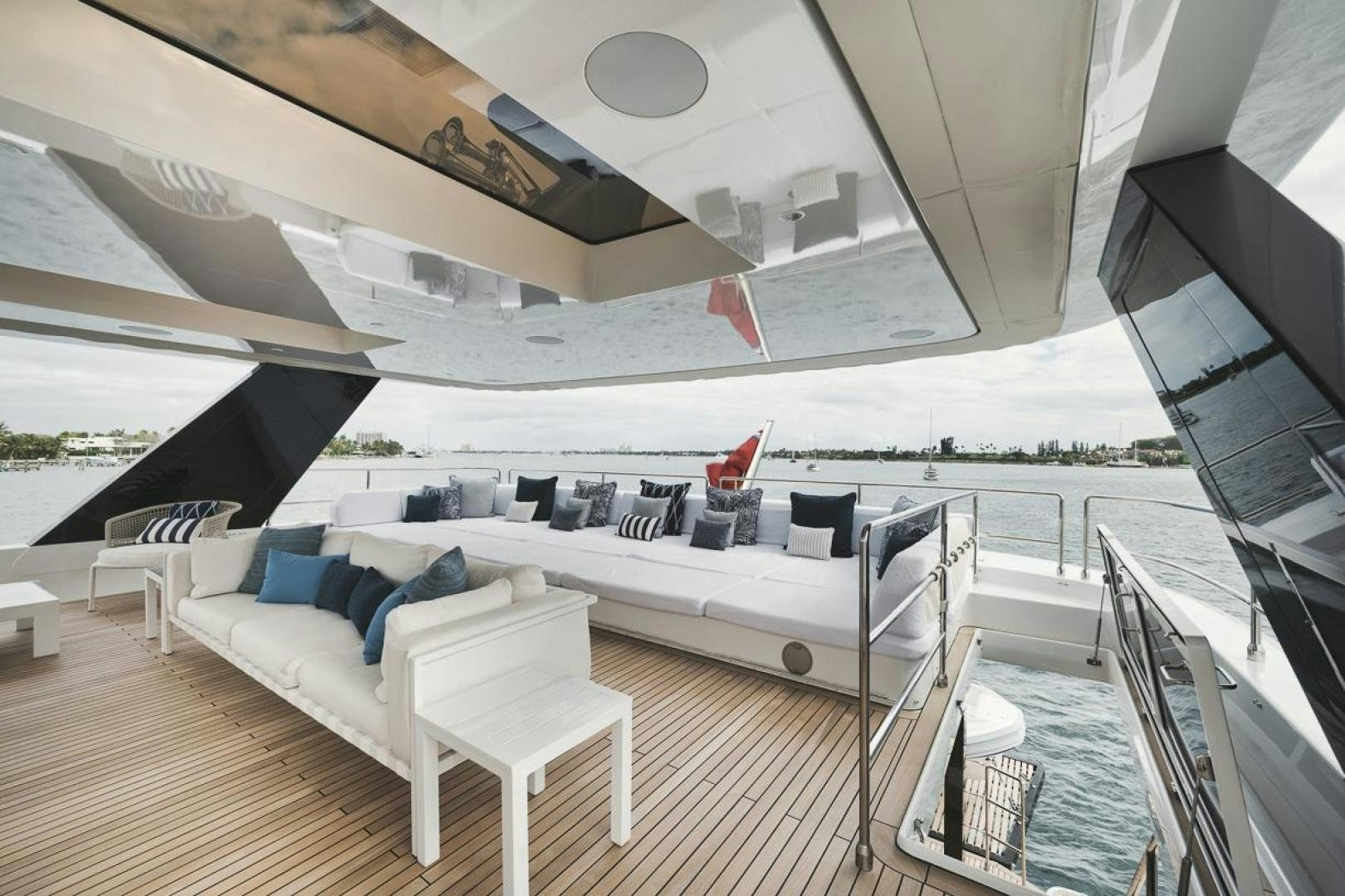 a large white lounge chair on a deck with a large white lounge chair and a large white lounge aboard SANDY II Yacht for Sale