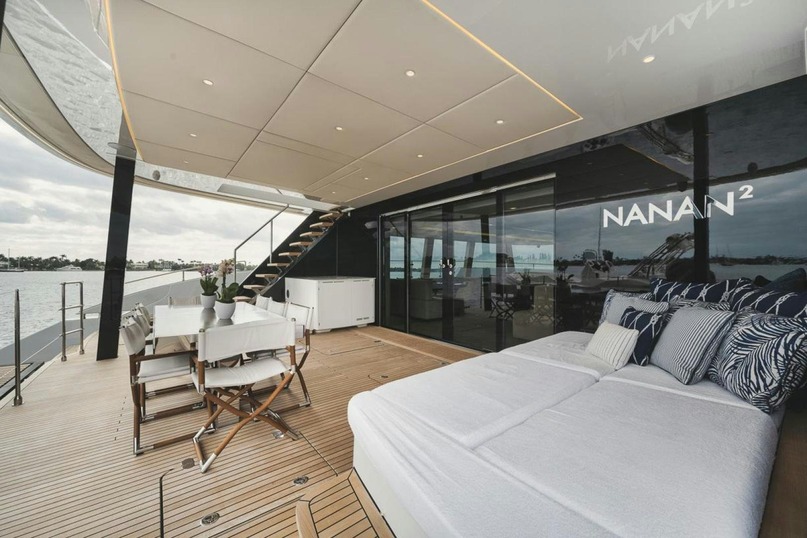 a room with a couch and a table and chairs aboard SANDY II Yacht for Sale