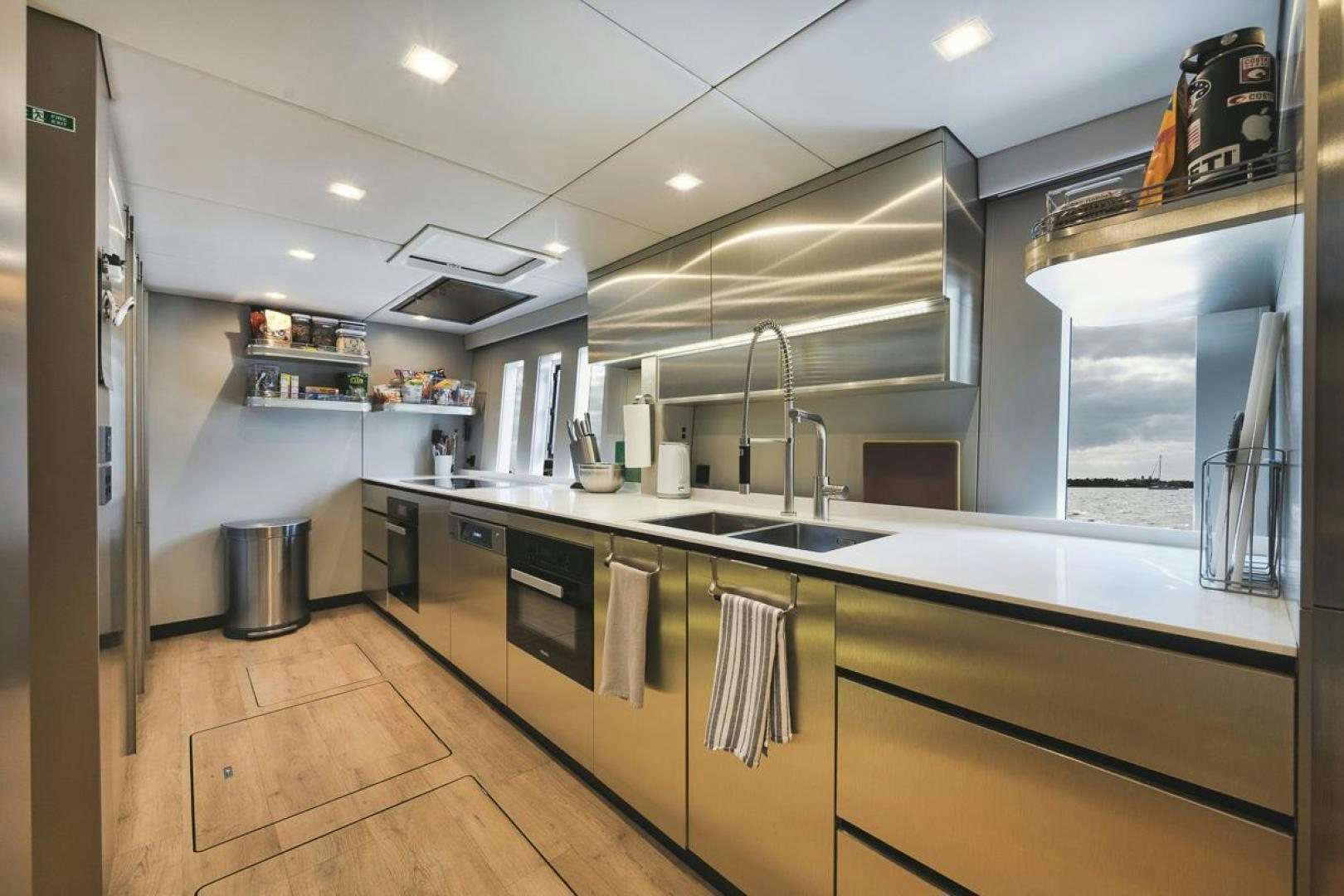 a kitchen with a large island aboard SANDY II Yacht for Sale