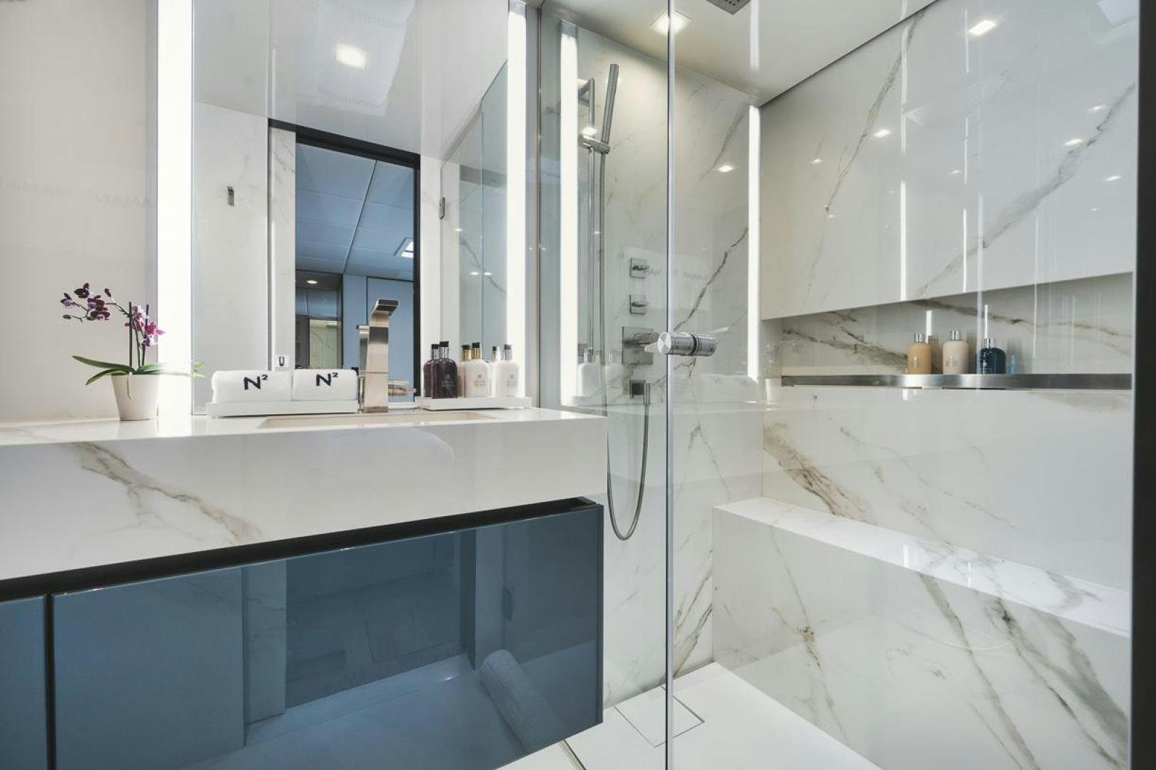 a bathroom with a shower aboard SANDY II Yacht for Sale
