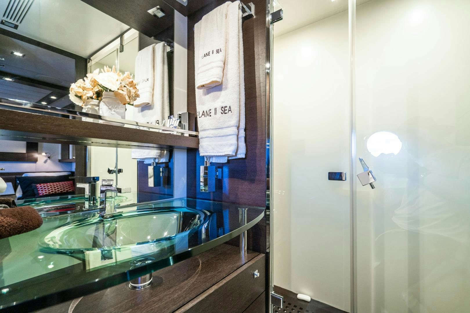 a kitchen with a countertop sink and cabinets aboard PLANE II SEA Yacht for Sale