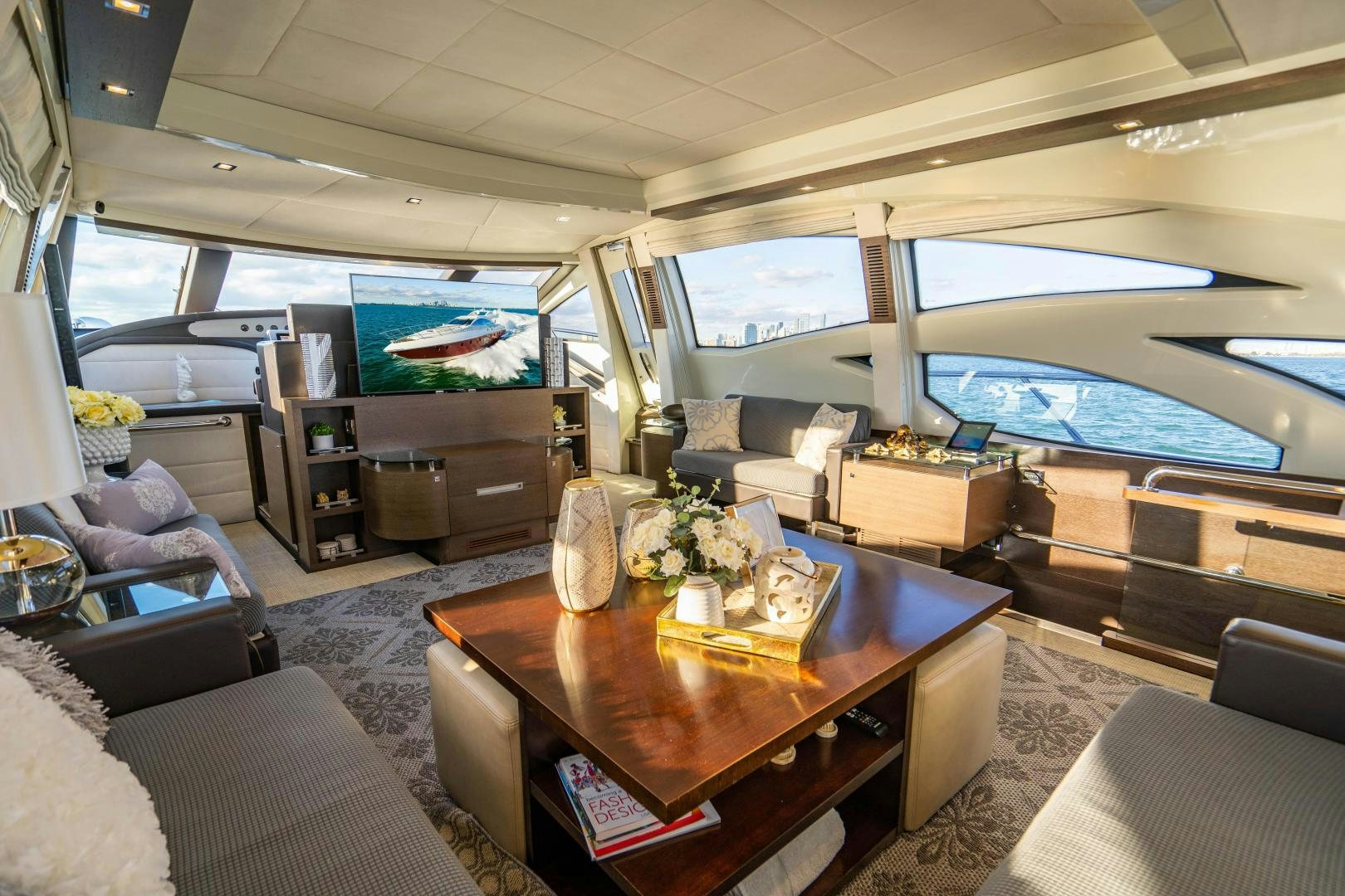 a living room with a large window aboard PLANE II SEA Yacht for Sale