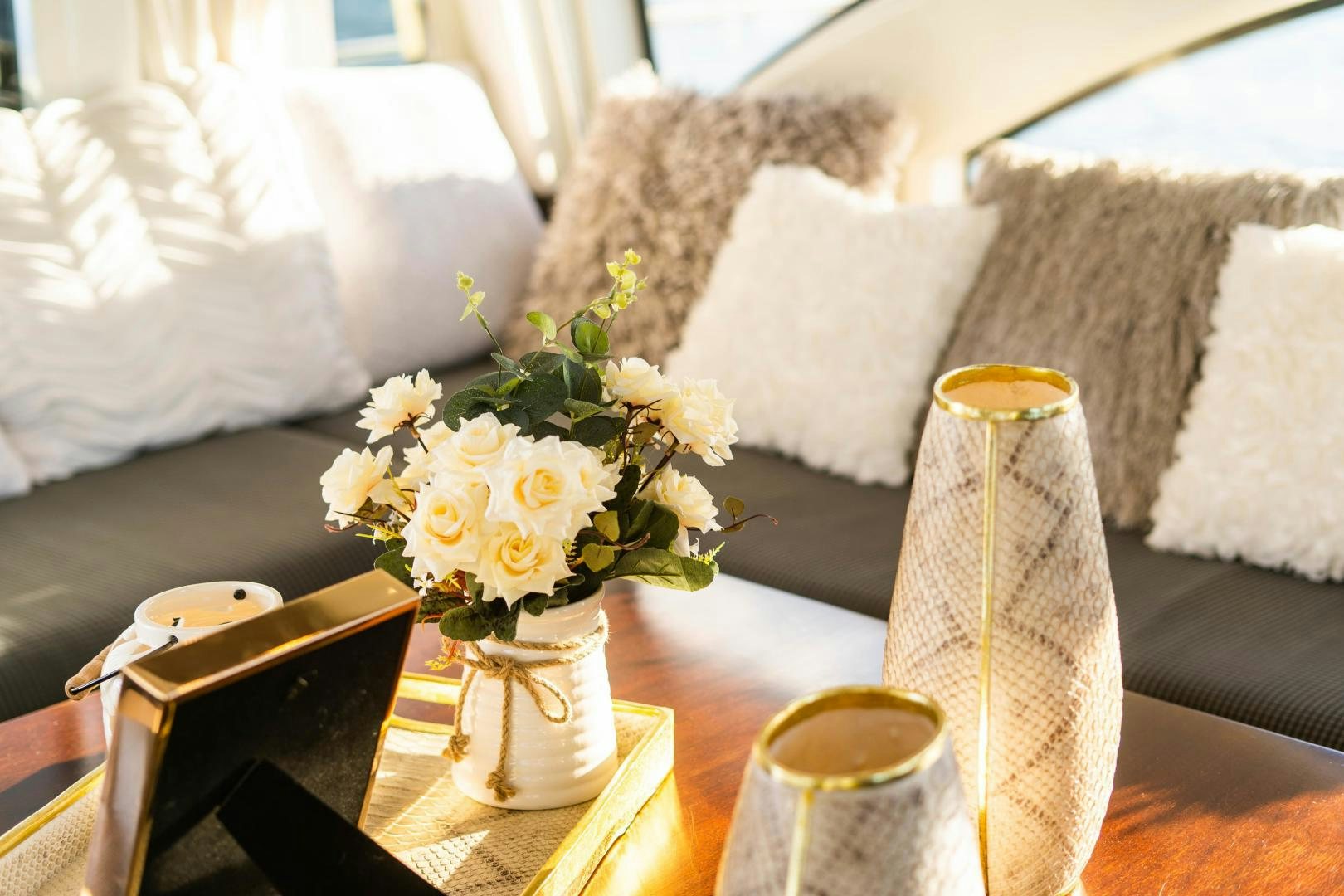 a vase of flowers on a table aboard PLANE II SEA Yacht for Sale