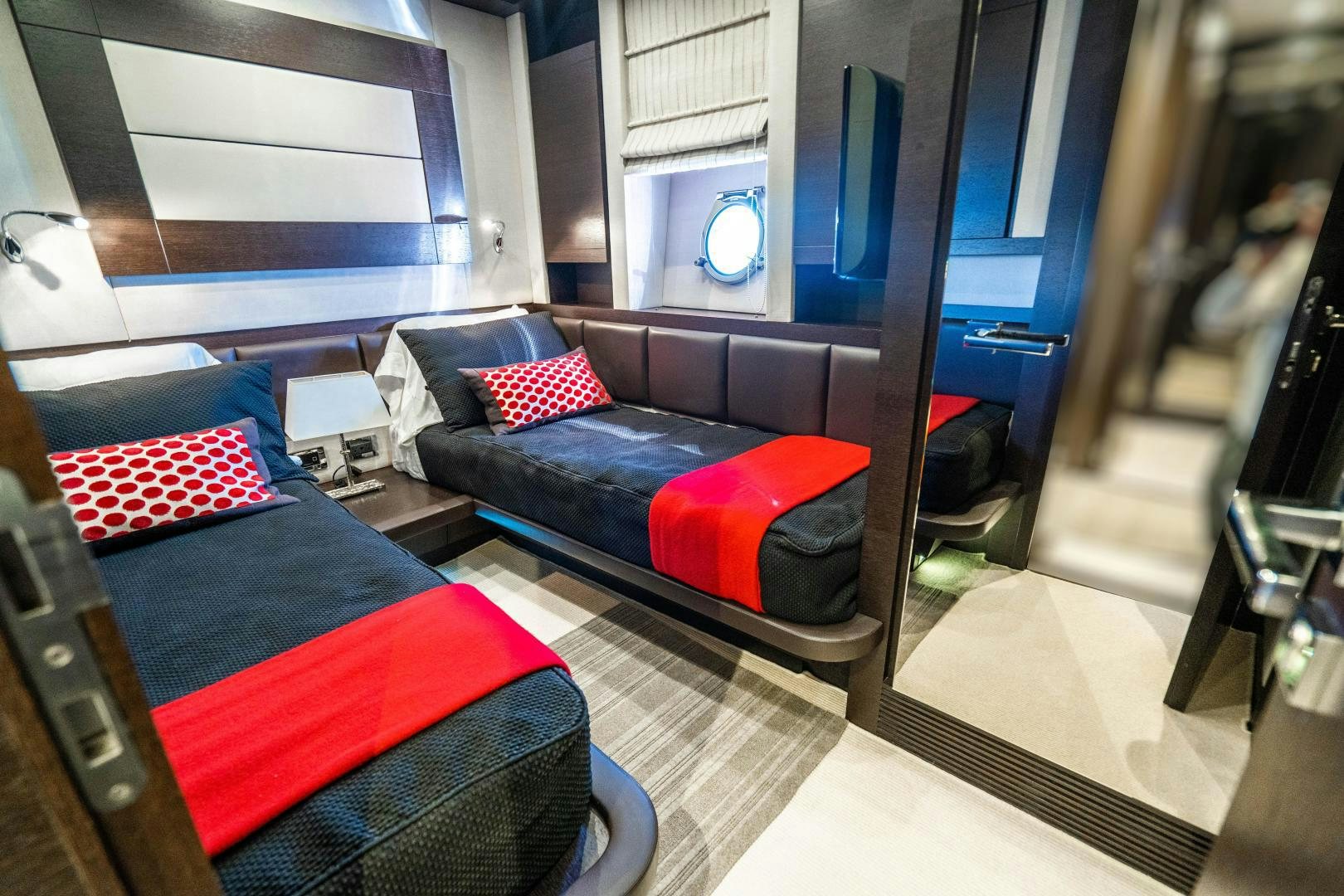 a living room with a blue couch aboard PLANE II SEA Yacht for Sale