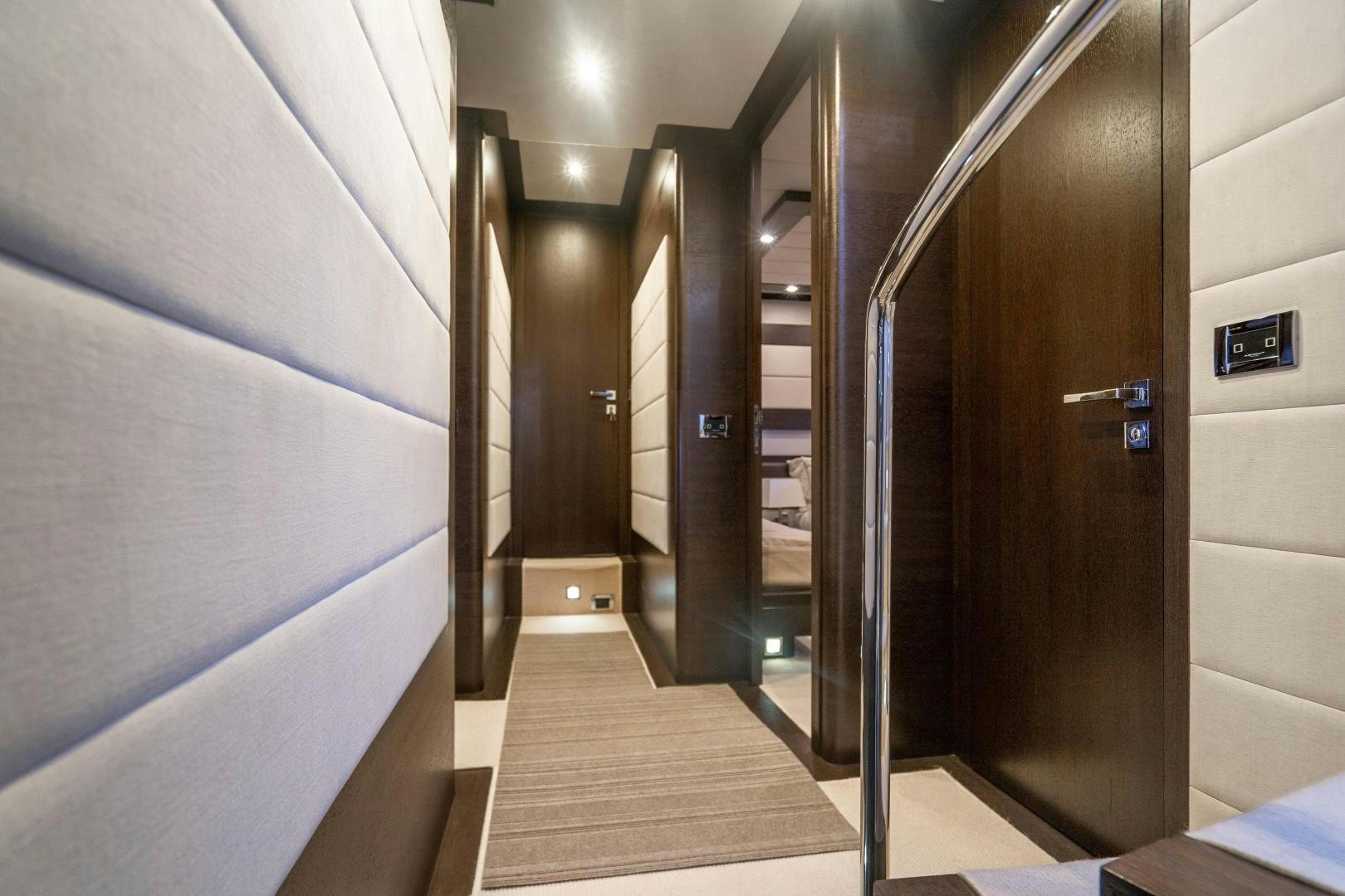 a hallway with doors aboard PLANE II SEA Yacht for Sale