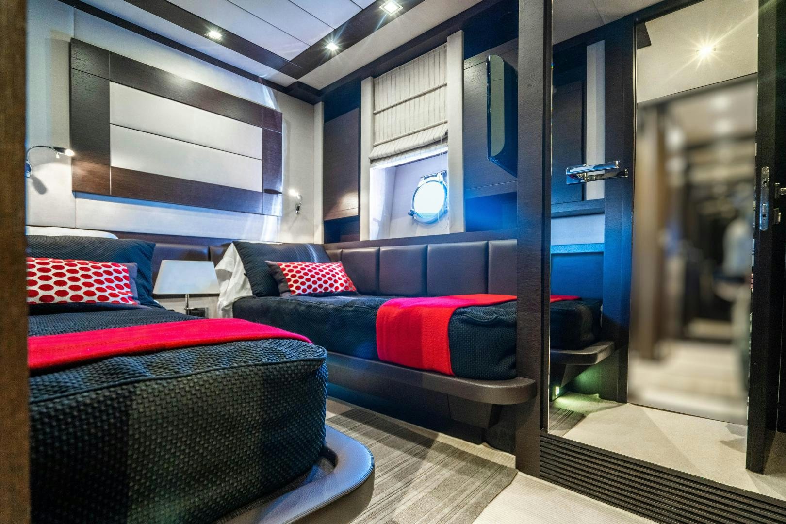 a room with a couch and a chair aboard PLANE II SEA Yacht for Sale