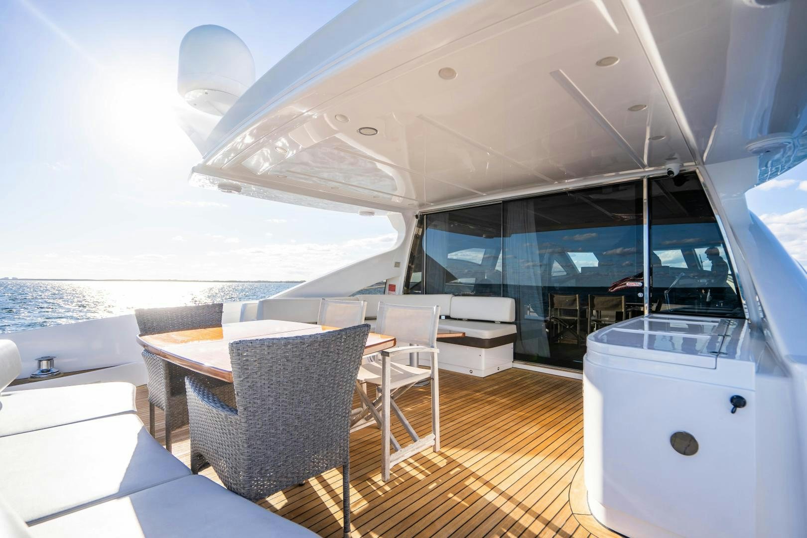 a boat with a table and chairs aboard PLANE II SEA Yacht for Sale