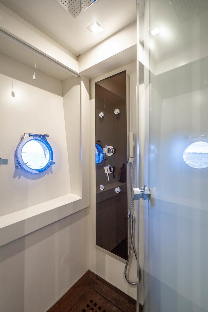a bathroom with a shower unit aboard PLANE II SEA Yacht for Sale