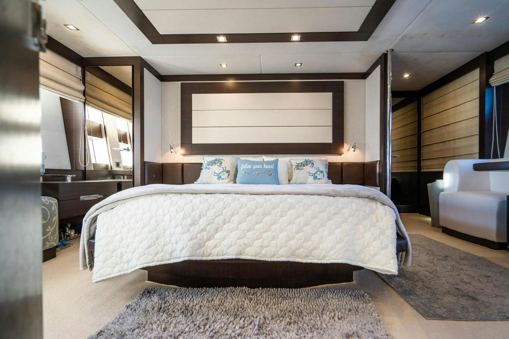 a large bed in a room aboard PLANE II SEA Yacht for Sale