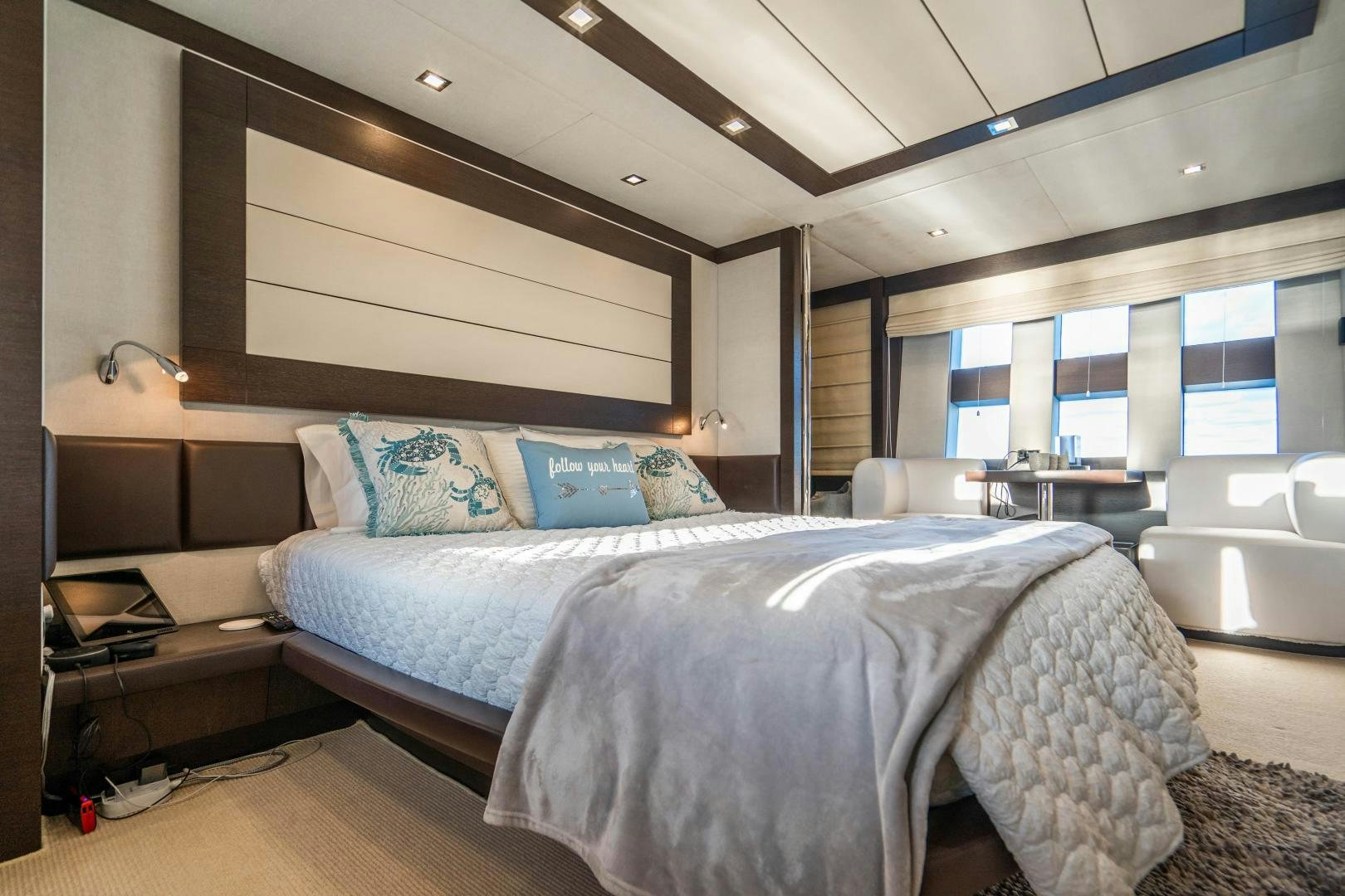 a bedroom with a large bed aboard PLANE II SEA Yacht for Sale