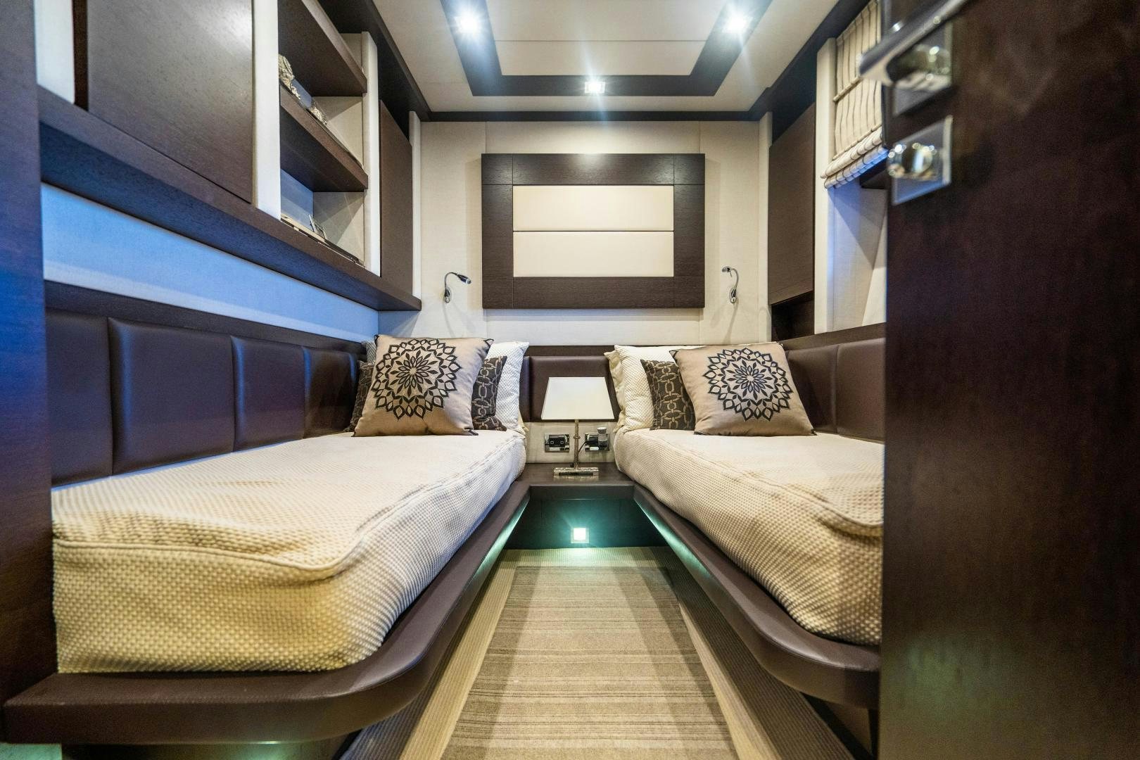 a room with two beds aboard PLANE II SEA Yacht for Sale