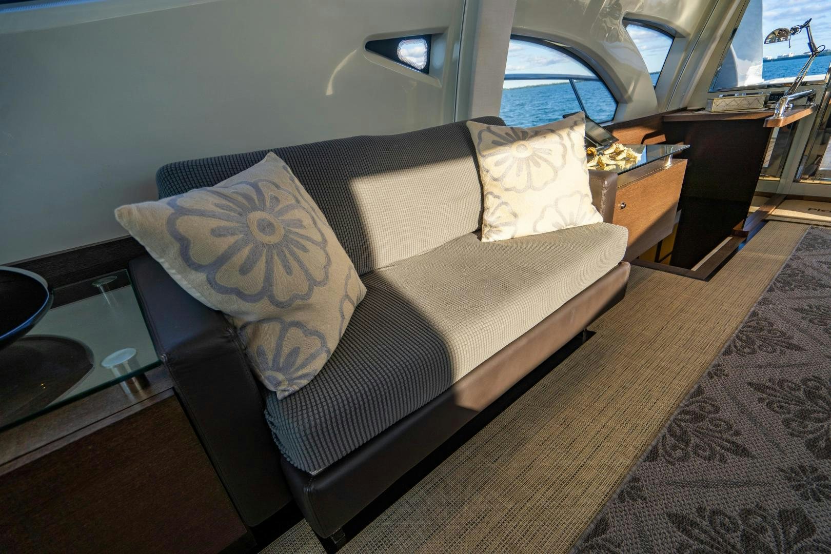 a couch in a room aboard PLANE II SEA Yacht for Sale