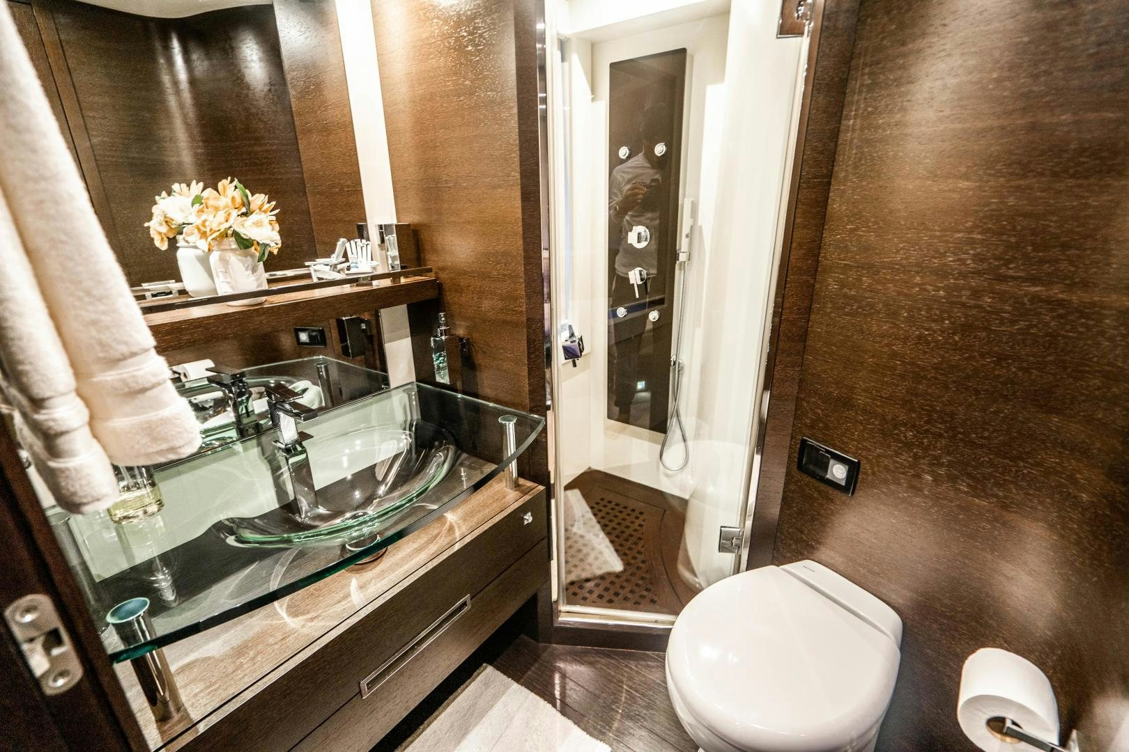a bathroom with a glass counter aboard PLANE II SEA Yacht for Sale