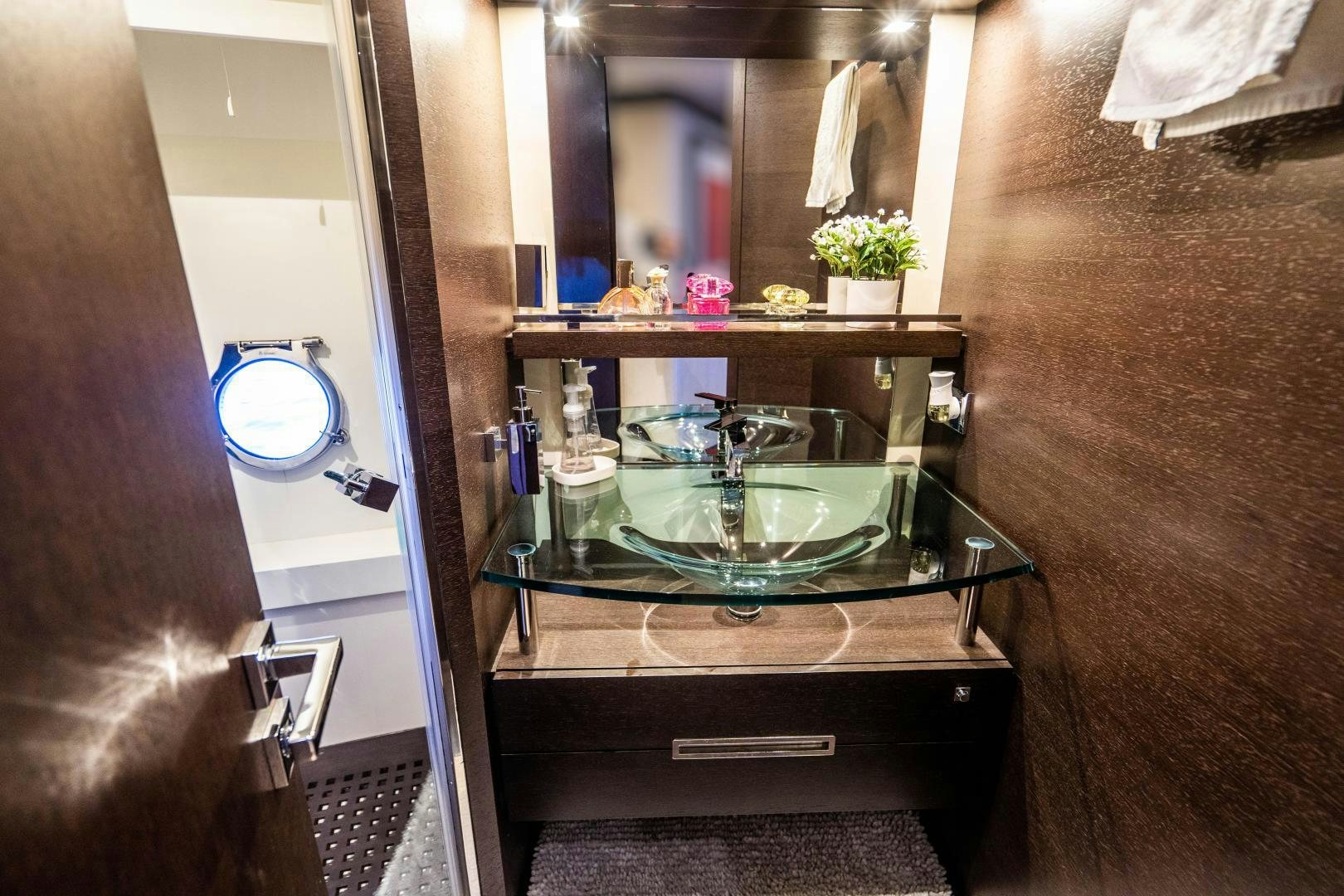 a bathroom sink with a mirror aboard PLANE II SEA Yacht for Sale