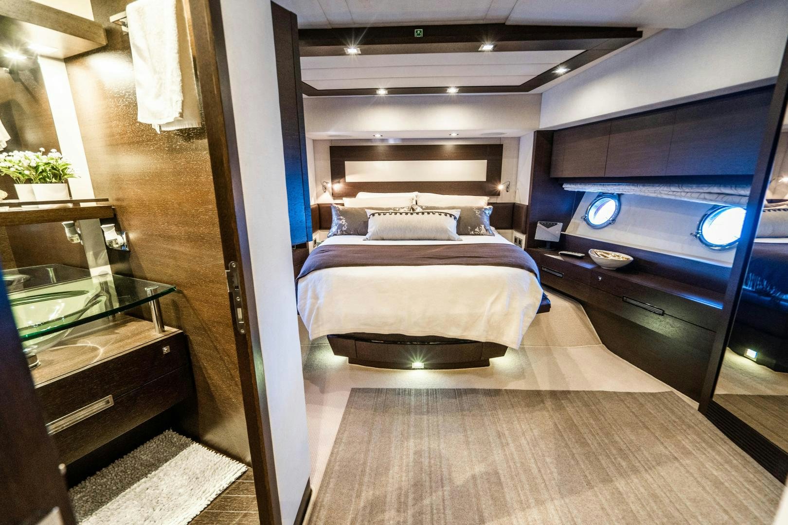a bedroom with a bed aboard PLANE II SEA Yacht for Sale
