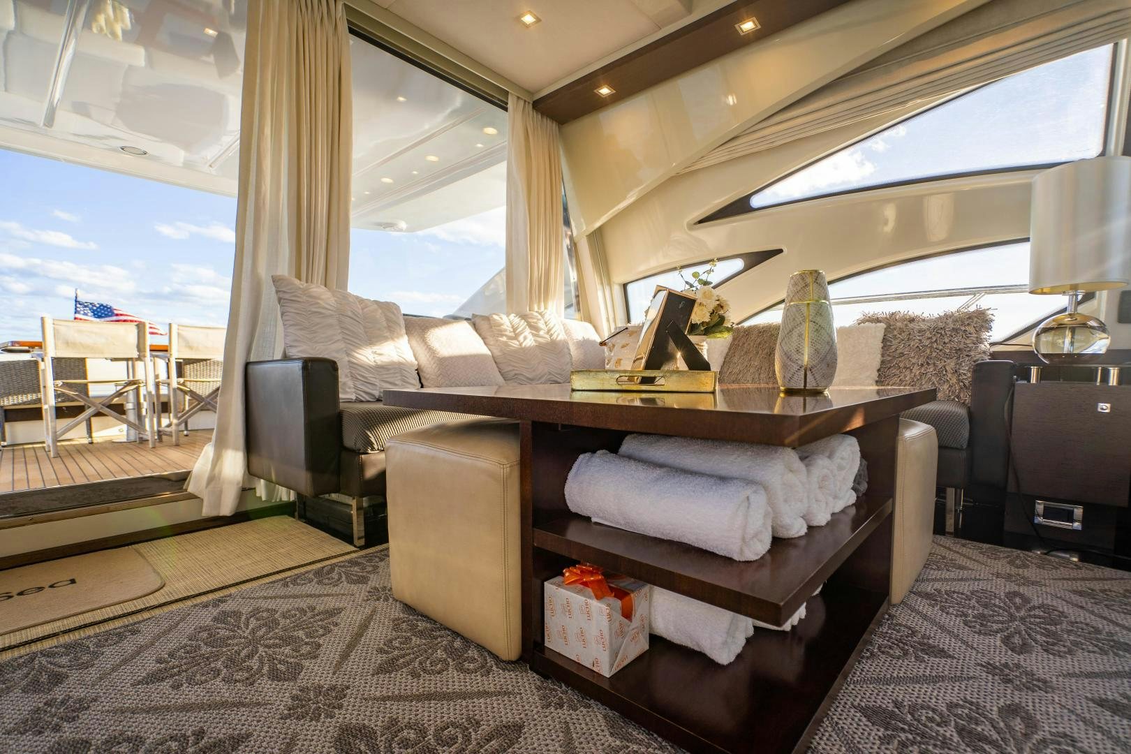 a room with a bed and a large window aboard PLANE II SEA Yacht for Sale
