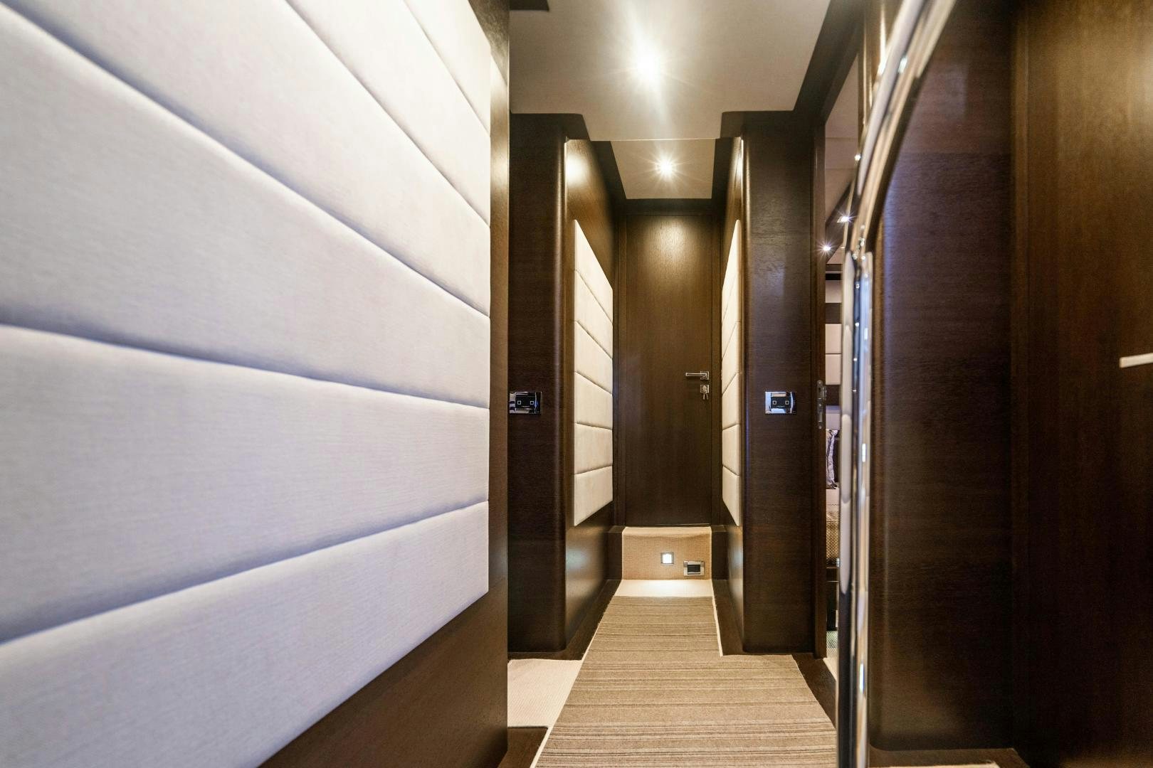 a hallway with doors aboard PLANE II SEA Yacht for Sale