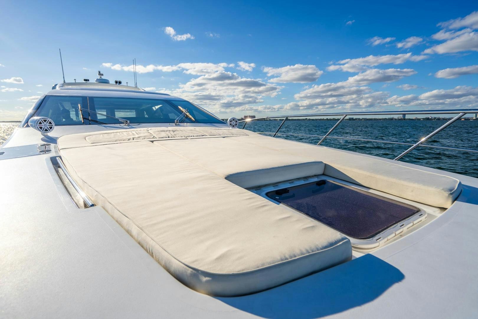 a white yacht on the water aboard PLANE II SEA Yacht for Sale