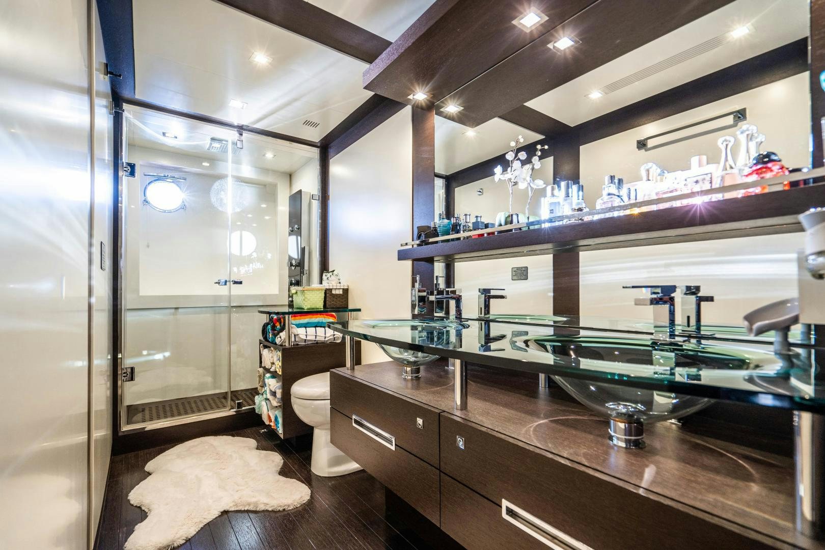 a room with shelves and a sink aboard PLANE II SEA Yacht for Sale