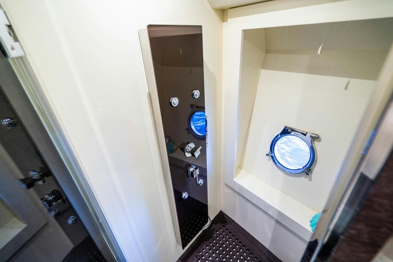 a bathroom with a blue circle aboard PLANE II SEA Yacht for Sale