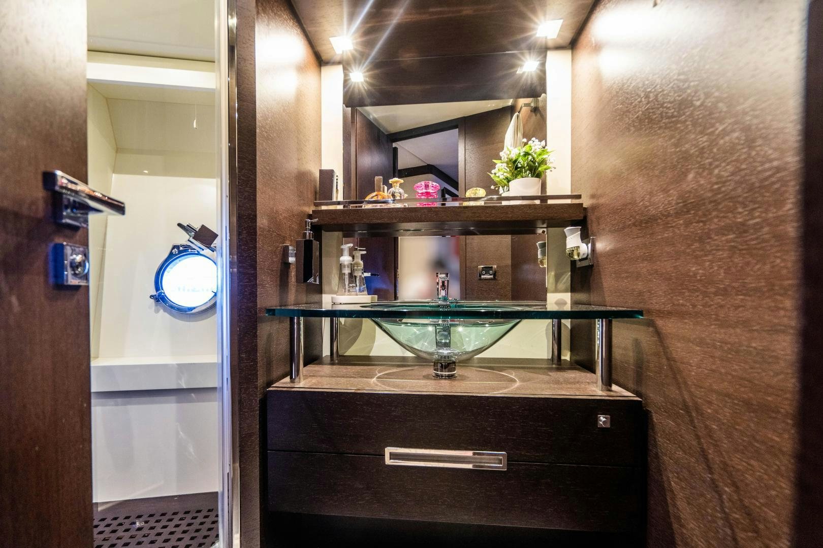 a bathroom with a sink and a mirror aboard PLANE II SEA Yacht for Sale