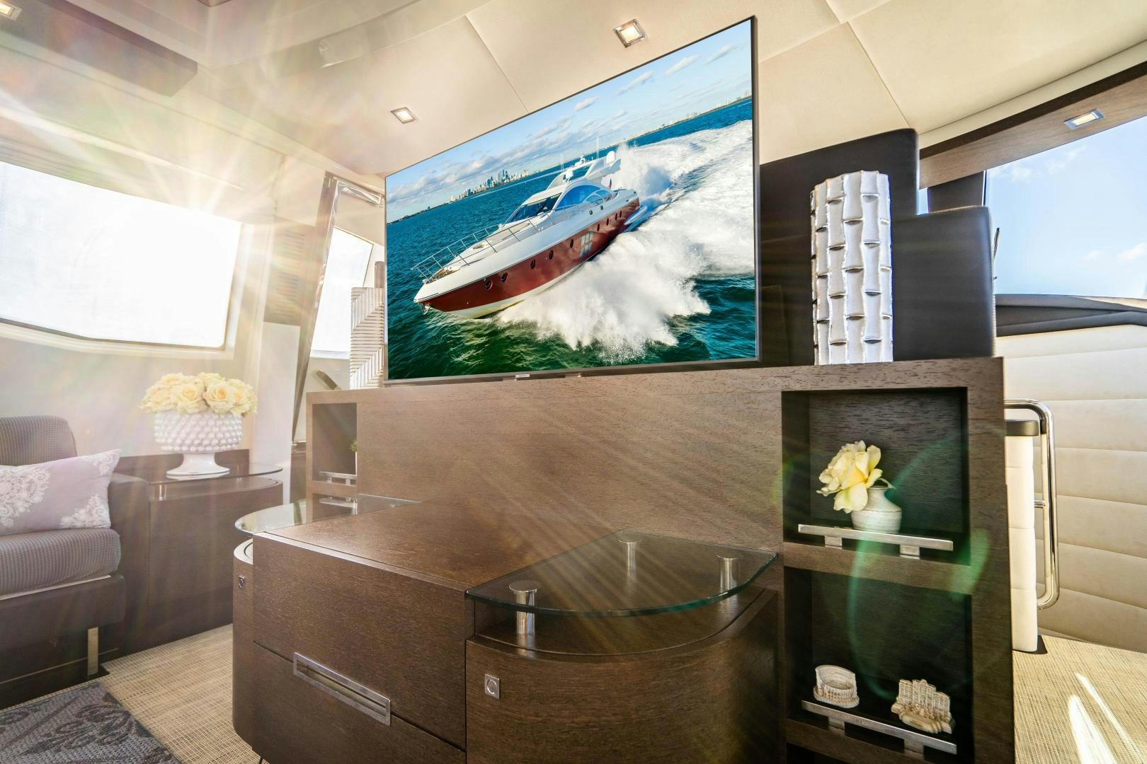 a room with a tv and a couch aboard PLANE II SEA Yacht for Sale