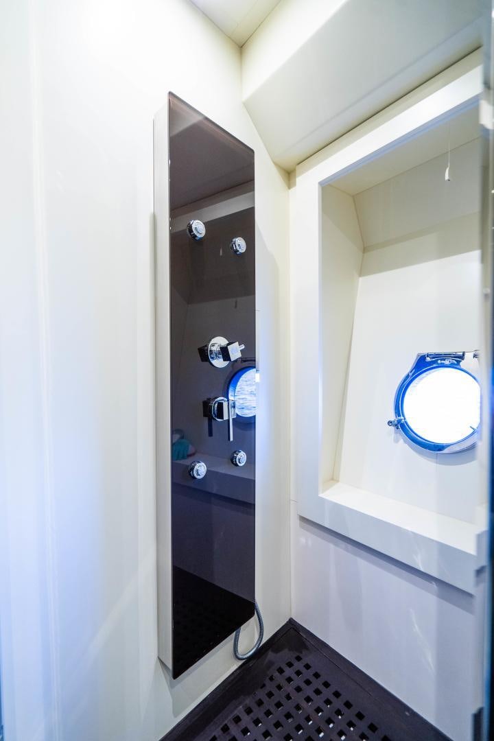 a bathroom with a mirror aboard PLANE II SEA Yacht for Sale