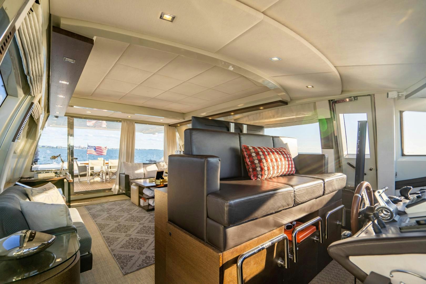 a living room with a leather couch aboard PLANE II SEA Yacht for Sale