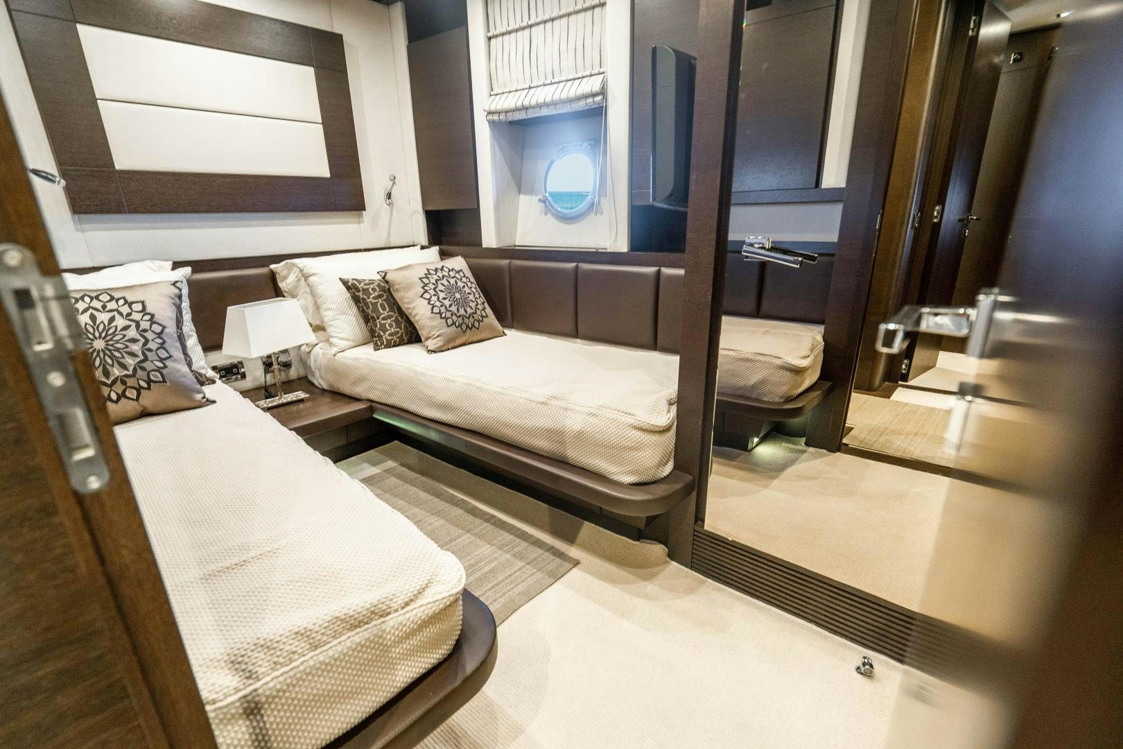 a room with a couple beds aboard PLANE II SEA Yacht for Sale
