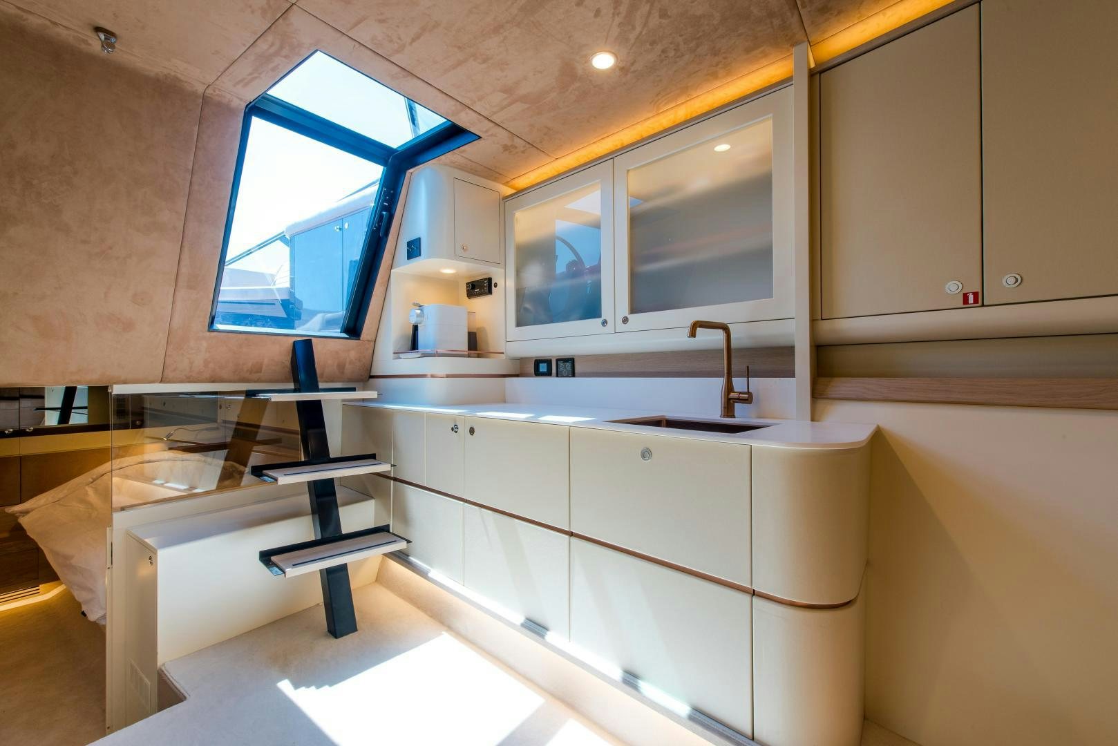 a kitchen with a ladder aboard BENEAU WATERDREAM 52 Yacht for Sale