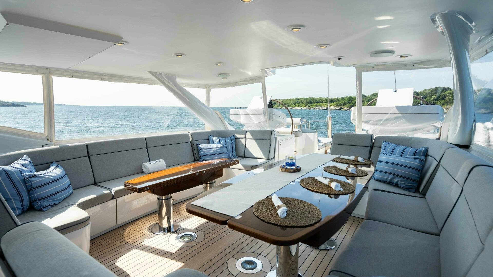 a living room with a large glass window aboard ANEMOI Yacht for Sale