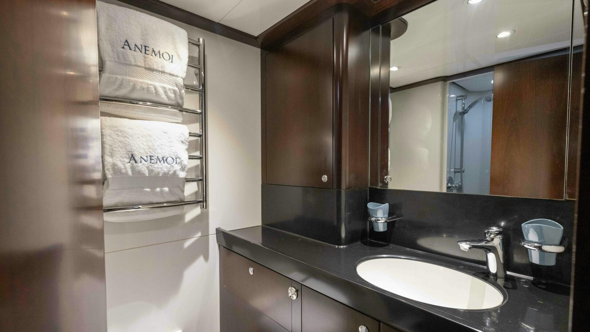 a bathroom with a sink and a mirror aboard ANEMOI Yacht for Sale