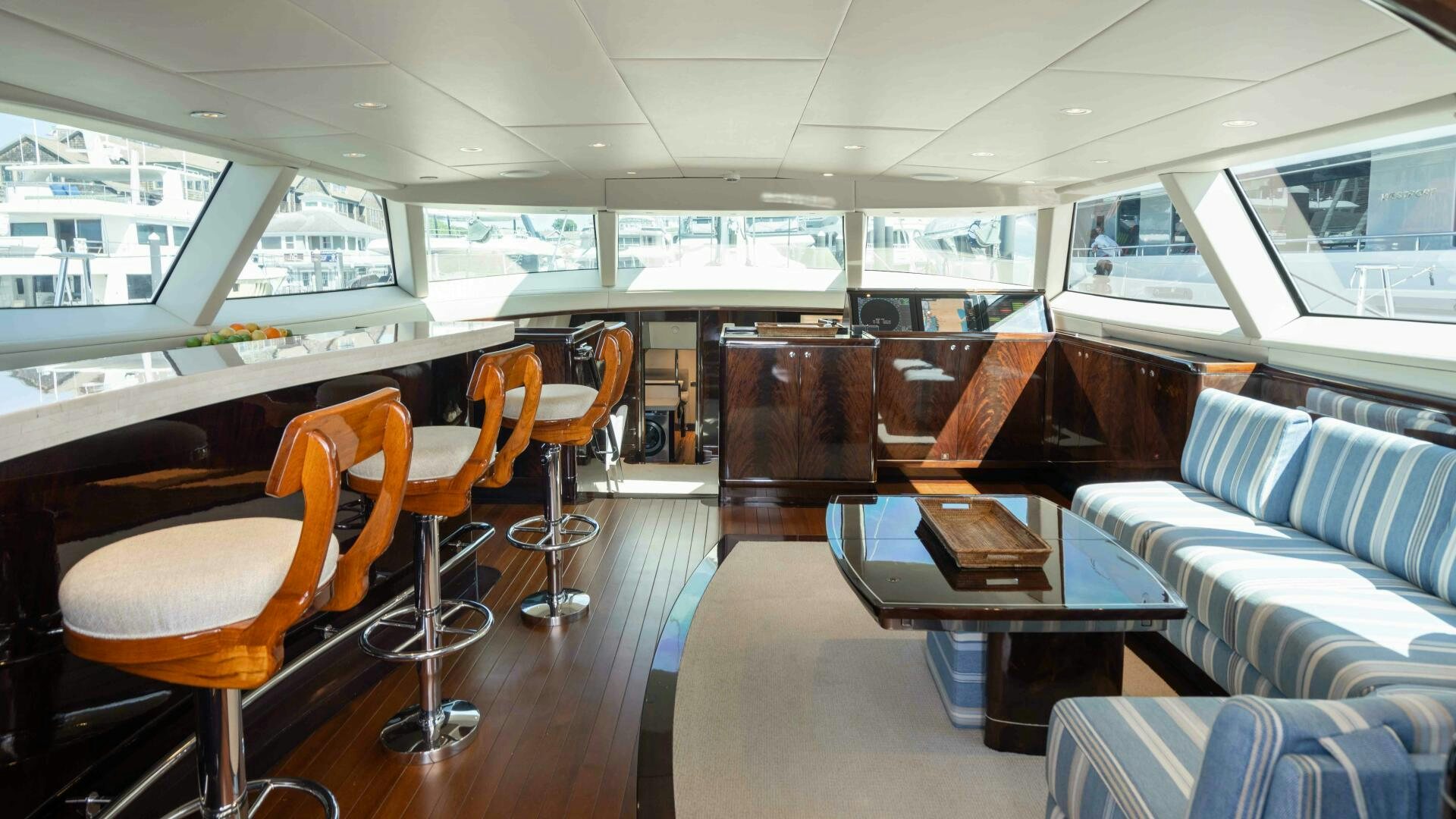 inside of a vehicle with tables and chairs and a couch aboard ANEMOI Yacht for Sale