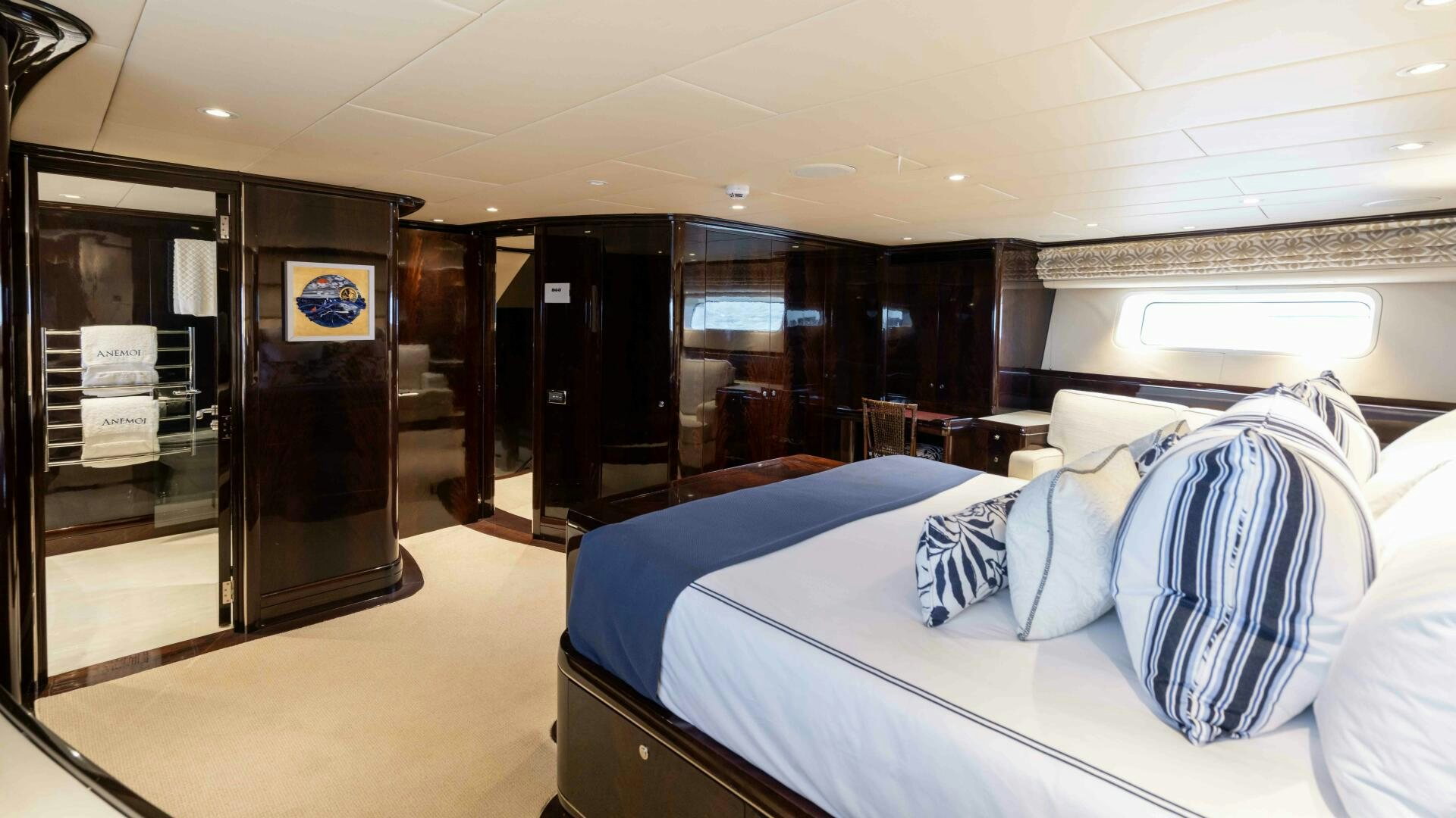 a room with a bed and a door aboard ANEMOI Yacht for Sale