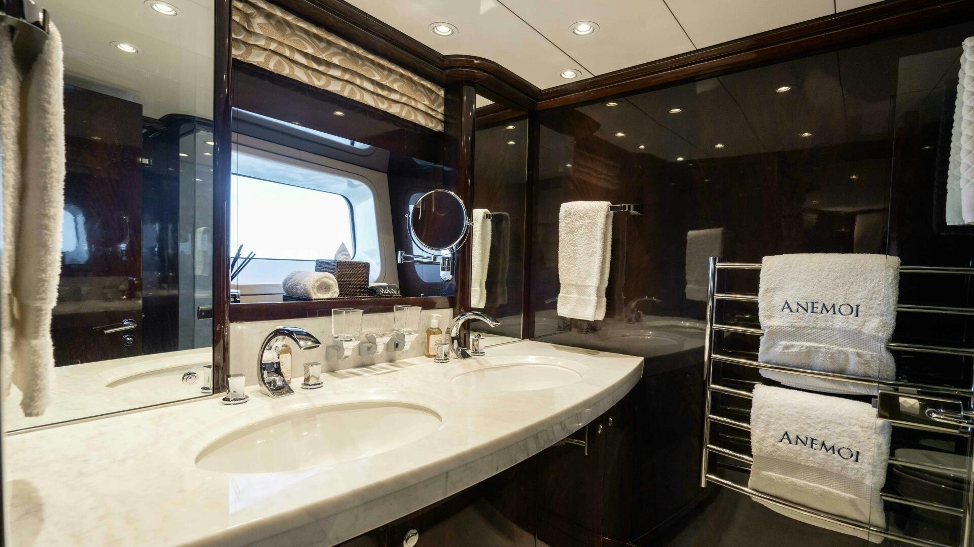 a bathroom with a sink and mirror aboard ANEMOI Yacht for Sale