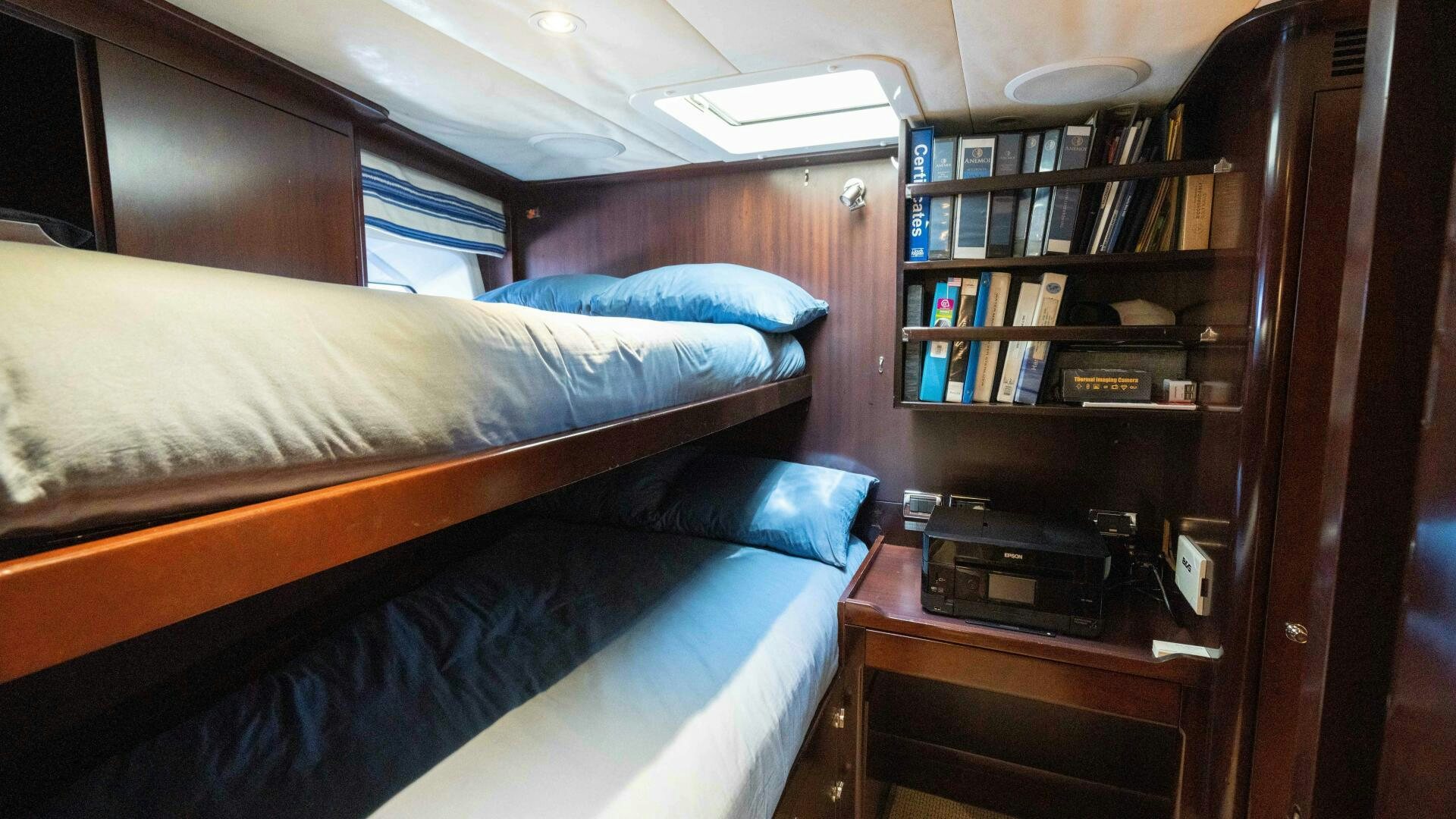 a couple of beds in a room aboard ANEMOI Yacht for Sale